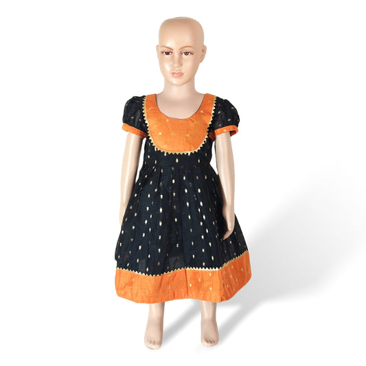 A mannequin displaying a vibrant orange and black Chanderi cotton frock with sleeves and a belt.
