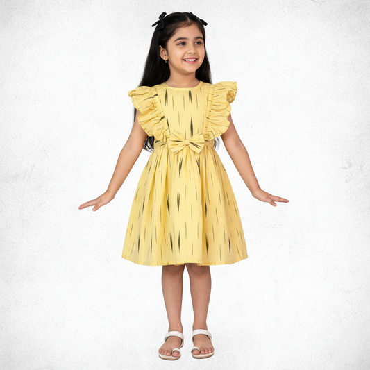 girl wearing yellow cotton frock with ikat pattern