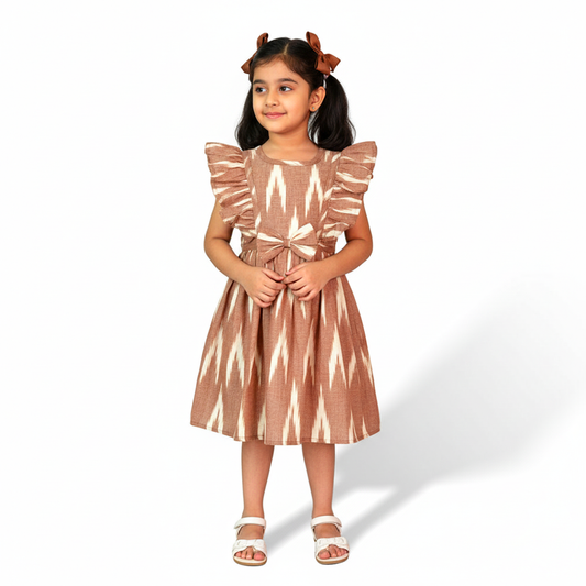 girl wearing brown cotton frock with ikat design