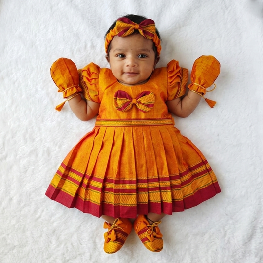 Orange Irkal baby girl festive dress set with matching hairband and booties