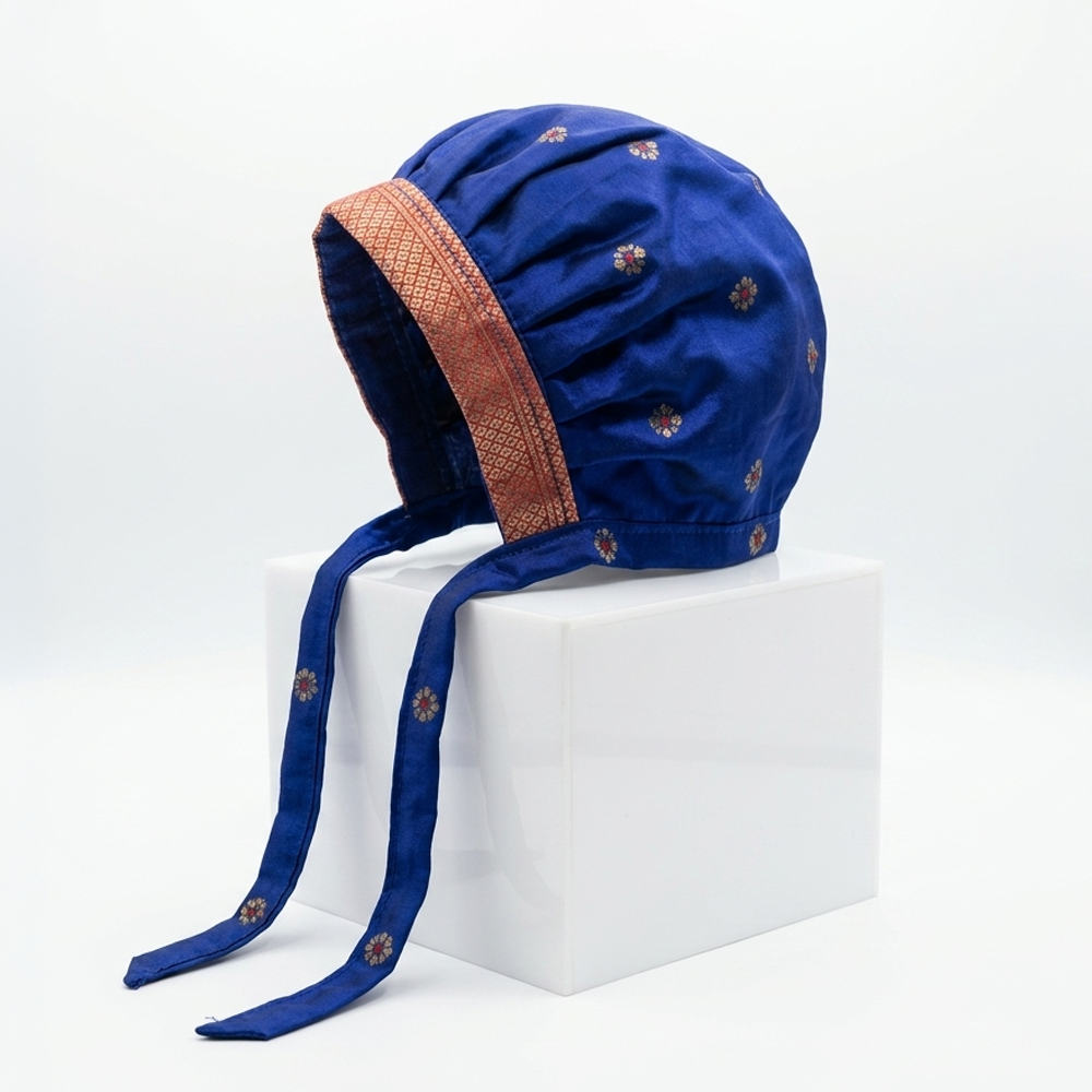 Royal blue Paithani baby bonnet cap with zari border for newborn girls traditional wear
