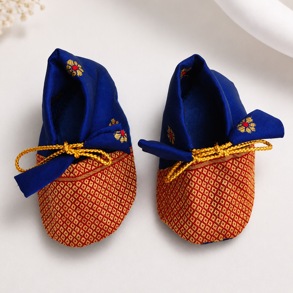 Royal blue Paithani baby shoes for newborn girls with golden zari pattern and ethnic design