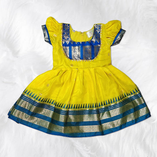 Beautiful traditional frock design for girls with floral prints and bright colors.